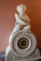 Marble cherub atop barometer with signs of zodiac on entrance hall fireplace at Holmwood. Glasgow, Scotland.