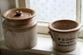 Stoneware crocks in kitchen in Reid farmhouse at National Museum of Rural Life. Kittochside, Scotland.