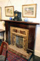 Fireplace with Van Delft tile from England plus mantel clock by Robert Stewart of Glasgow in dining room of Reid farmhouse at National Museum of Rural Life. Kittochside, Scotland.