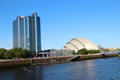 Crowne Plaza tower & Armadillo on Clyde River. Glasgow, Scotland.