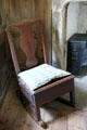 Rocking chair in garden room at Culross Palace. Culross, Scotland.