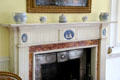 Fireplace with white & blue bisque inserts in portico bedroom at Manderston House. Duns, Scotland.