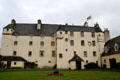 Traquair House with towers & wing additions. Scotland.