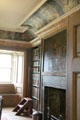 Library fireplace with ceiling frieze painted with philosopher portraits at Traquair House. Scotland.