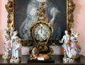 Mantel clock from Paris surrounded by Meissen or Dresden figurines in great hall at Glamis Castle. Angus, Scotland.
