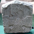 Pictish grave stone with tri-lobed locking waves in centre of cross at Meigle Sculptured Stone Museum. Meigle, Scotland.
