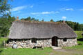 Highland cottage with thatch roof & stone walls at Highland Folk Museum. Newtonmore, Scotland.