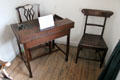 Burns' chair & writing table used by Burns while visiting Old Manse of Lochmaben at Robert Burns House. Dumfries, Scotland.
