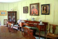 Dining room with Glasgow Boys group paintings over sideboard at Broughton House. Kirkcudbright, Scotland.