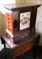 Table top chest of drawers with coats of arms of Bairds & Smiths families at Broughton House. Kirkcudbright, Scotland.