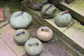 Antique curling stones in garden at Broughton House. Kirkcudbright, Scotland.