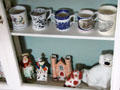 Ceramic cups & figurines in China Room at Castle Fraser. Aberdeenshire, Scotland.