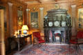 Ground floor entrance hall with fireplace & Aesop's fables paintings in paneling at Haddo House. Methlick, Scotland.