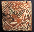 Inlaid clay heraldic lion floor tile from Lancaster Abbey, Lancashire at Gladstone Pottery Museum. Longton, Stoke, England.