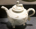 White teapot with applied molded leaf sprays relief decoration plus gilding made in North Straffordshire at Potteries Museum & Art Gallery. Hanley, Stoke-on-Trent, England.