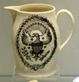 Creamware jug with over-glaze print of American coat-of-arms by Thomas Baddeley of Shelton, Staffordshire at Potteries Museum & Art Gallery. Hanley, Stoke-on-Trent, England.