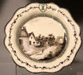 Queen's Ware dessert plate with painted English country scene by Wedgwood at World of Wedgwood. Barlaston, Stoke, England.
