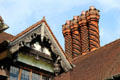 Carved verge board & spiral brick chimneys on half-timber gable at Wightwick Manor. Wolverhampton, England.