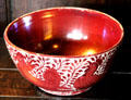 Red lustre bowl with comical birds by William De Morgan at Wightwick Manor. Wolverhampton, England.