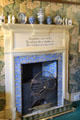 Arts & Crafts style fireplace with printed poem surrounded by Acanthus wallpaper by William Morris at Wightwick Manor. Wolverhampton, England.