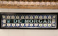 W De Morgan shop front tile sign by William De Morgan for showroom at 45 Great Marlborough St., London. England.