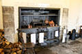 Cast iron wood stove by Richardson & Clingen of Enniskillen in kitchen at Florence Court. Enniskillen, Northern Ireland.