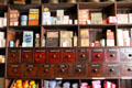 Spice drawers, antique tins & boxes in W G O'Doherty Licensed Grocery shop at Ulster American Folk Park. Omagh, Northern Ireland.