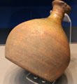 Earthenware water sprinkler used by monks on young plant from London, England at British Museum. London, United Kingdom.