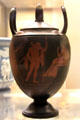 Black Basalt vase with red encaustic decoration by Josiah Wedgwood with partner Thomas Bentley turning potter's wheel with design copied from ancient Greek vase at British Museum. London, United Kingdom.