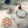 Collection of tableware designed by Peter Behrens including red wine glass & fork at British Museum. London, United Kingdom.