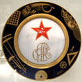 Russian porcelain plate with Red Star design by M. Adamovich for SPF at British Museum. London, United Kingdom.