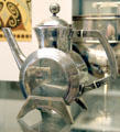 Silver tea pot with drum-shaped body by Christopher Dresser made by Elkington & Co. of Birmingham at British Museum. London, United Kingdom.
