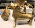 Bronze lion aquamanile ridden by human & dog from Germany at British Museum. London, United Kingdom.