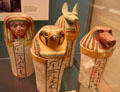Four painted wooden dummy Canopic jars at British Museum. London, United Kingdom.