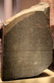 Rosetta Stone is inscribed with three versions of a decree: Ancient Egyptian in hieroglyphics & Demotic scripts plus Ancient Greek which was used to decode the top two writings. at British Museum. London, United Kingdom.