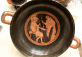 Greek terracotta red figure kylix with Zeuxo pouring wine for Chrysippos attrib. to Brygos painter made in Athens at British Museum. London, United Kingdom.