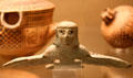 Greek bronze siren once attached to cauldron rim at British Museum. London, United Kingdom.