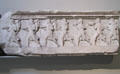 Architrave frieze showing young men rushing forward with food & wine for a feast on Nereid Monument at British Museum. London, United Kingdom.