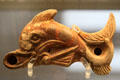 Terracotta oil lamp in form of dolphin made in Italy at British Museum. London, United Kingdom.