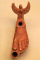 Terracotta oil lamp in form of sandaled foot made in Italy, found in Libya at British Museum. London, United Kingdom.