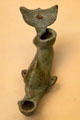 Roman bronze oil lamp in form of dolphin at British Museum. London, United Kingdom.