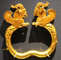 Ancient Iranian Achaemenid culture gold armlets of winged monsters with griffin heads found in Oxus River Treasure, Tajikistan at British Museum. London, United Kingdom.