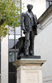 Pre-Raphaelite painter John Everett Millais memorial sculpture outside Tate Britain. London, United Kingdom.