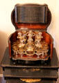 Liquor chest with gilded decanters & stemmed glasses at Conde-Charlotte Museum. Mobile, AL.