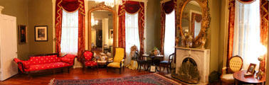 Parlor with sofa & chairs at Historic Oakleigh Museum House. Mobile, AL.
