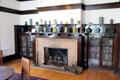 Living room fireplace with collection of Arts & Crafts era pottery in Corbett House at Tucson Museum of Art. Tucson, AZ