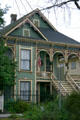 Green Eastlake-style house. Sacramento, CA.
