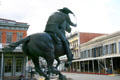 Pony Express monument gallops toward the B.F. Hastings Building, once Pony Express HQ in Old Sacramento. Sacramento, CA.
