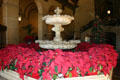 Entrance lobby fountain with poinsettias of Biltmore Hotel. Los Angeles, CA.