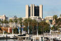 Long Beach City Hall over shoreline developments & palms. Long Beach, CA.